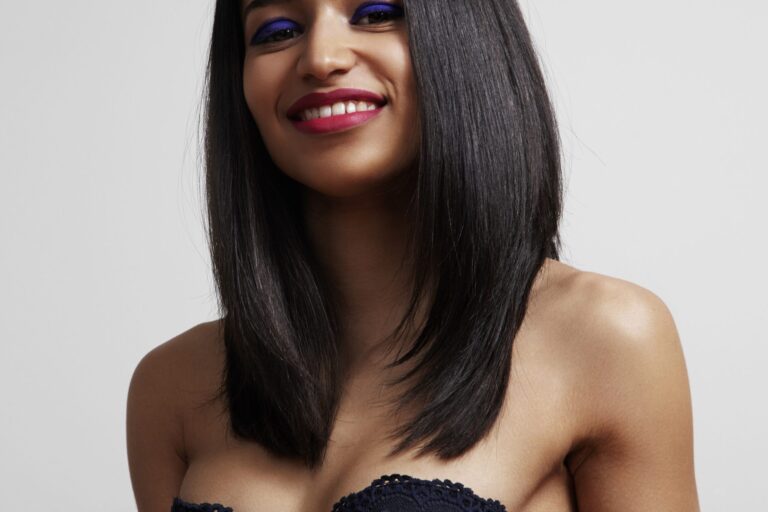 brunette woman with a bright makeup and stright shiny hair